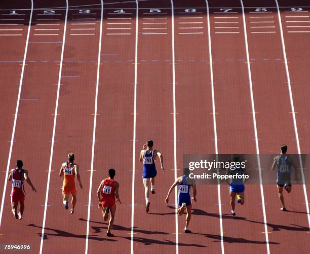 9th World Championships in Athletics, Paris, France, 26th August 2003, Mens 100m Heats, Competitors during the race with the finishing line in view