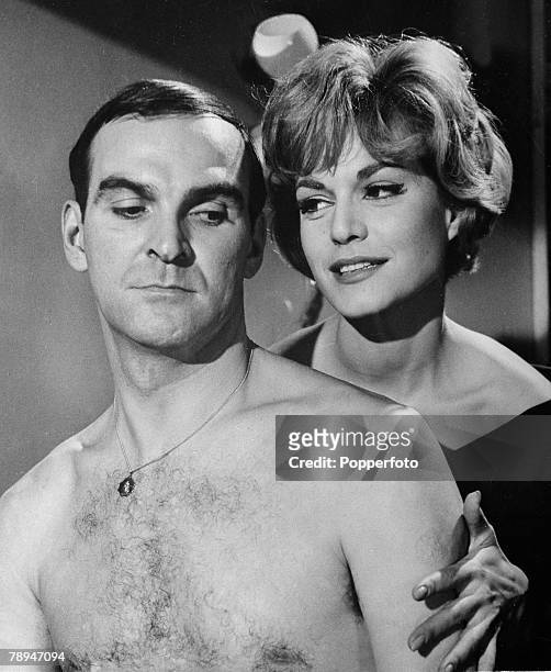 Film, 23rd February 1960, British movie actor Stanley baker seen here with German actress Margit Saad from the film " The Concrete Jungle"