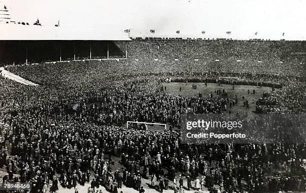 28th April 1923, FA,Cup Final at Wembley, Bolton Wanderers 2, v West Ham United 0, Official Attendance: 126 Part of the huge crowd overflows from the...