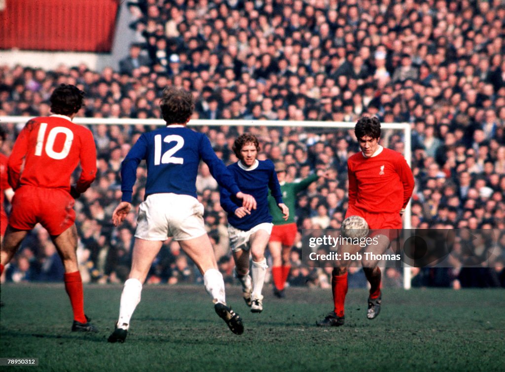 FA. Cup Semi-Final. Old Trafford, Manchester, England. 27th March,1971. Liverpool 2 v Everton 1. Emlyn Hughes of Liverpool, brings the ball away from Everton's Alan Ball, during this local derby.