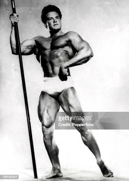 Steve Reeves, Mr, America 1947, poses with a spear