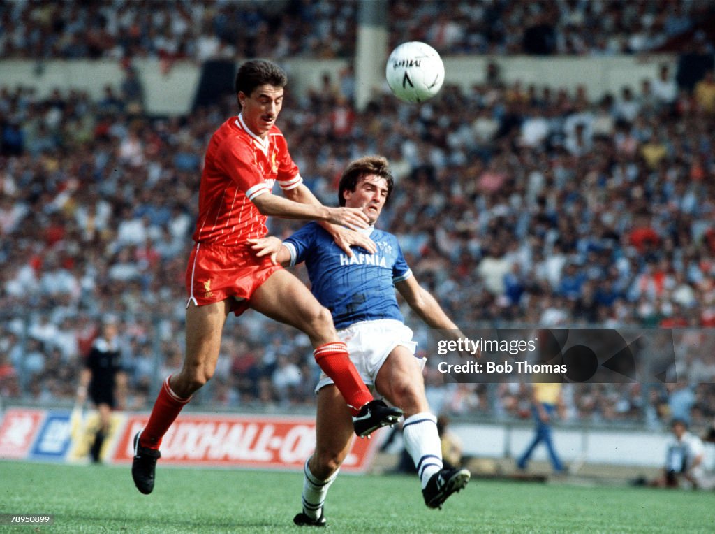 1984-85. Liverpool v Everton. Liverpool's Ian Rush challenges Everton's Kevin Ratcliffe in the air, during the Merseyside derby.