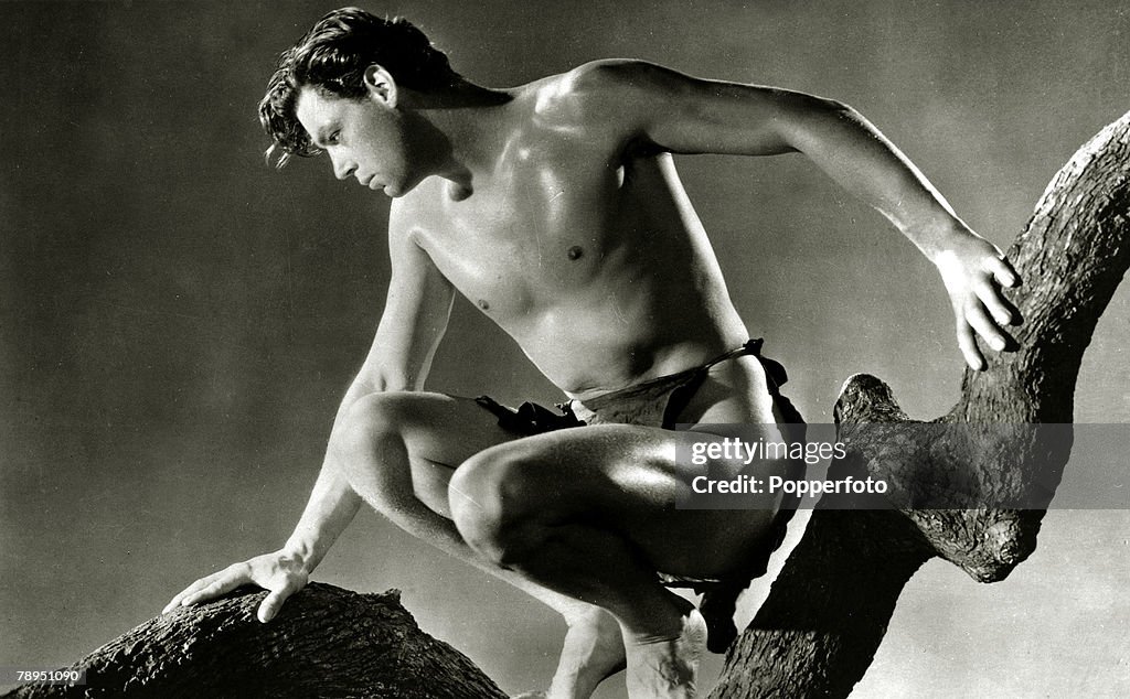 Stage and Screen. Sport. Personalities. pic: circa 1934. Actor Johnny Weissmuller in the film " Tarzan And His Mate". Johnny Weissmuller, (1904-1984) born in Romania, became a 5 time Olympic Swimming gold medal winner for the U.S.A, and found movie fame w