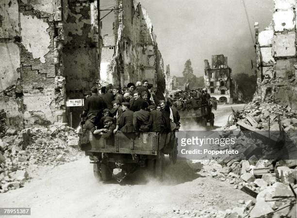War and Conflict, World War Two, pic: 1945, German prisoners being driven through the ruined town of Falaise, Normandy, after the Allies had won the...