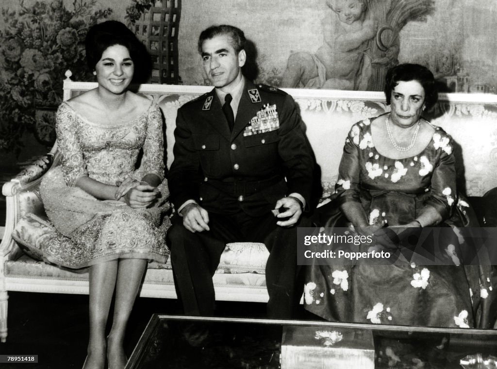 Foreign Royalty. Personalities. pic: 25th November 1959. The Shah of Iran (Persia) pictured with his fiancee Farah Diba and the Queen Mother at a private engagement party in Tehran. The Shah of Iran (1919-1980) succeeded his father in 1941, but was to lea