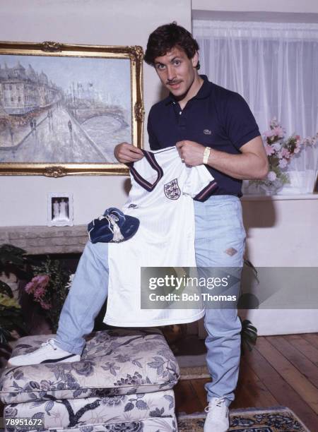 Sport, Football, Circa 1980's, Arsenal's Kenny Sansom at home holding an England shirt and cap