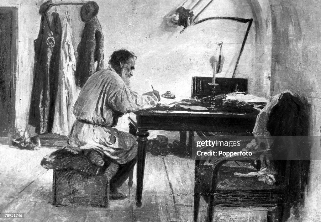 Russian novelist Count Leo Tolstoy 1828 - 1910, writer of monumental books "War And Peace" and "Anna Karenina", pictured seated at his scantily furnished study at Yasnaya Polyana.
