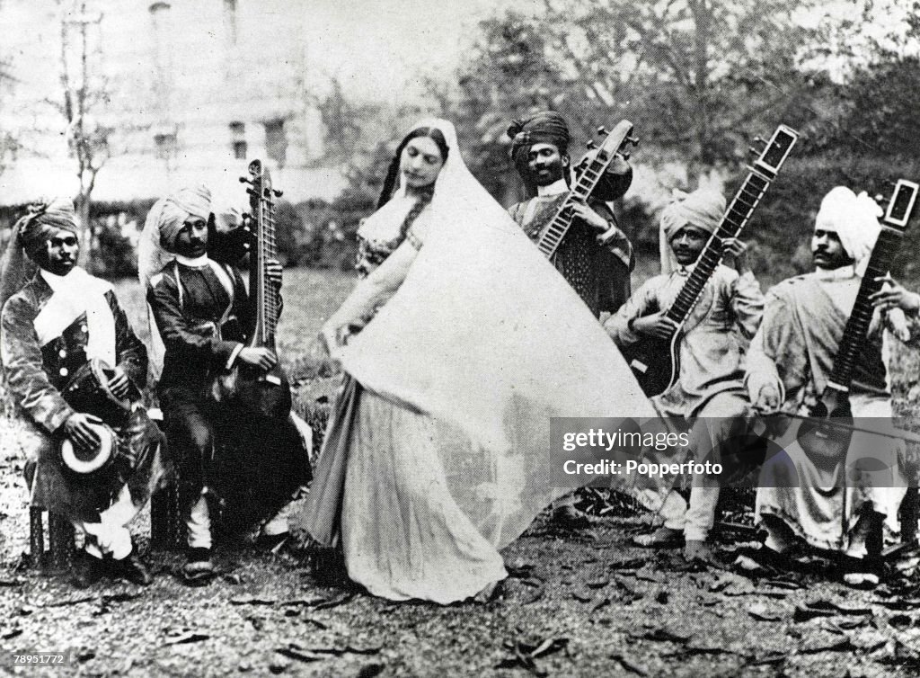 Exotic Dutch dancer Mata Hari who lived in France and was executed as a German spy in World War One, pictured in Paris practicing her Javanese Temple dance to music played by an Indian orchestra on sitars.