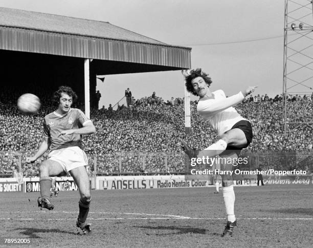 Terry McDermott of Liverpool shoots towards goal past Trevor Francis of Nottingham Forest during a Football League Division One match at the City...