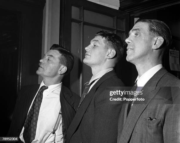 Boxing Doncaster, England, British Heavyweight boxer Bruce Woodcock is flanked by Father Sam , and Manager Tom Hurst