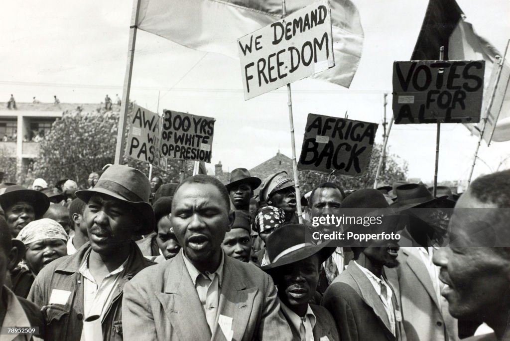 Race. Apartheid. South Africa. pic: 1952. Black African protesters seen among a crowd at a Johannesburg protest meeting which defied a ban on such gatherings.