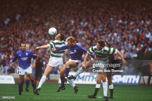 26th August 1989, Scottish Premier Division, Celtic 1 v Rangers 1, Rangers striker Maurice Johnston is challenged by Celtic pair Mike Galloway and...