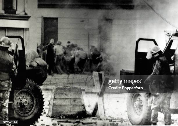 Scene during the Bloody Sunday riots, which broke out after British troops shot dead thirteen civilians during a civil rights march,...