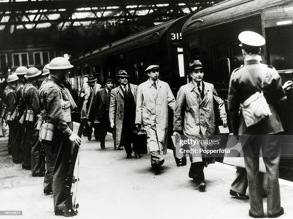 War and Conflict. World War Two. pic: May 1940. Men of German and Austrian origin being rounded up and being taken into internment camps, pictured here at a London station.