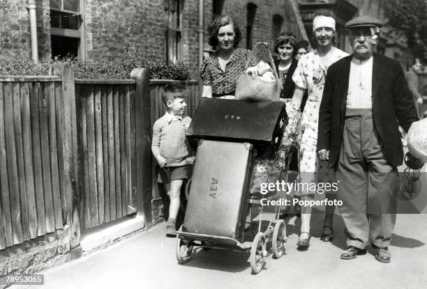 An English family, homeless and injured, having lost their home to German bombs in an air raid, but still seemingly cheerful, pictured in south west...