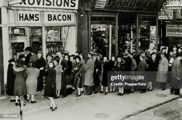War and Conflict, World War Two, pic: 24th March 1943, United States, A New York City queue with people lining up at food stores before rationing...