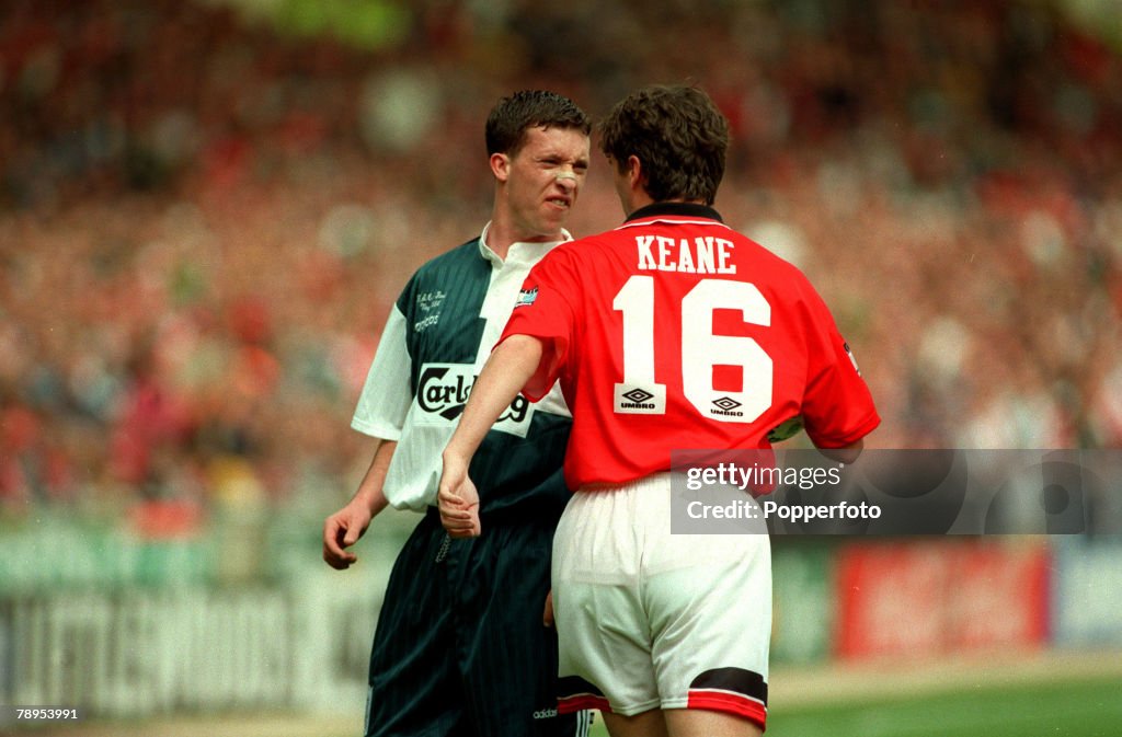 Sport. Football. pic: 11th May 1996. FA. Cup Final at Wembley. Liverpool 0. v Manchester United 1. Liverpool's Robbie Fowler in an angry exchange with Manchester United's Roy Keane.