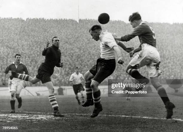 5th February 1949, Division 1, Chelsea v Preston North End, Chelsea centre forward Roy Bentley, right, leaps to score Chelsea's 1st goal with a header