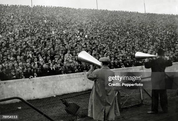 12th October 1935, Division 1, Chelsea v Arsenal, at Stamford Bridge, Stewards with megaphones marshalling the huge crowd on the terraces who have...