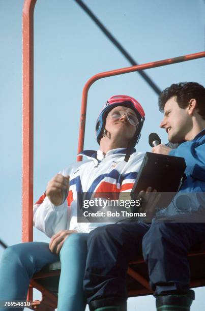 Sport, 1988 Winter Olympic Games, Calgary, Canada,Mens 70 and 90 metre Ski Jump, Great Britain's Eddie "The Eagle" Edwards interviewed on the lift by...