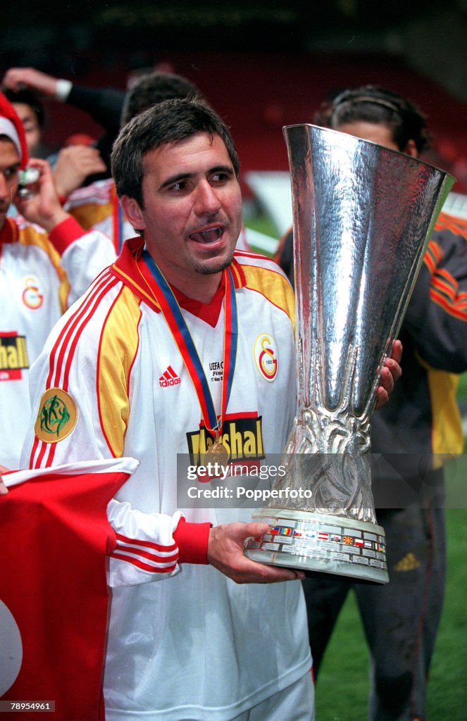 Football. UEFA. Cup Final. 17th. May, 2000. Copenhagen, Denmark. Galatasaray bt. Arsenal, 4-1 on penalties. (0-0 aet). Galatasaray's Gheorghe Hagi, with the UEFA. Cup, as the veteran enjoys the celebrations.