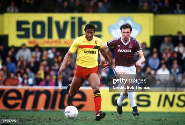 19th April 1986, Division 1, Watford 0 v West Ham United 2, Watford's John Barnes, left, on the ball as West Ham United's Alvin Martin gives chase
