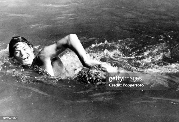American swimmer Johnny Weissmuller swimming circa 1924. Johnny Weissmuller would go on compete for the United States team to win gold medals in the...