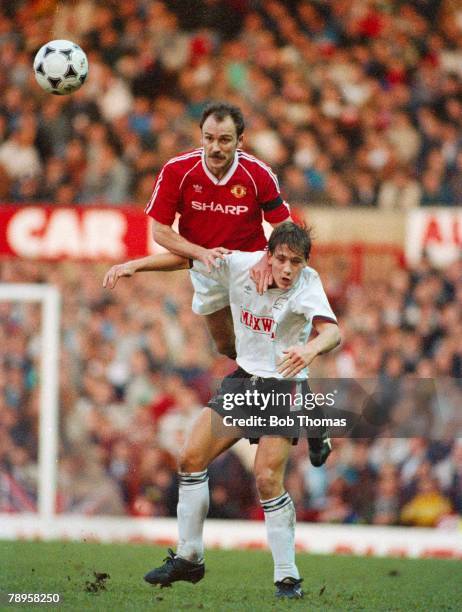 January 1990, Division 1, Manchester United 0 v Derby County 2, Manchester United's Mike Phelan outjumps Derby County's Craig Ramage