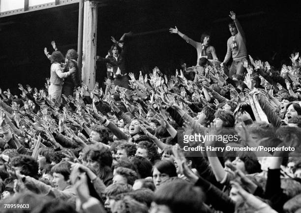 Everton supporters celebrate after Bob Latchford scored one of his hat-trick goals during the Football League Division One match between Everton and...