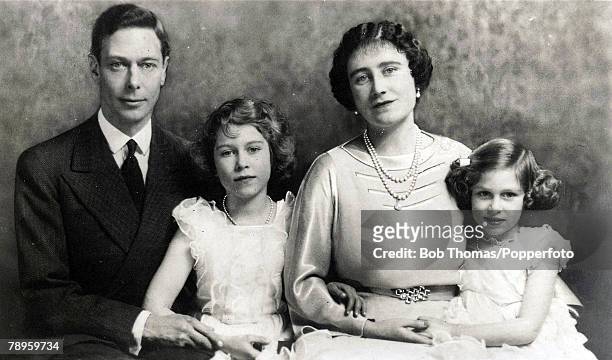 Family group shows King George VI and Queen Elizabeth with their daughters Princess Elizabeth and Princess Margaret rose.