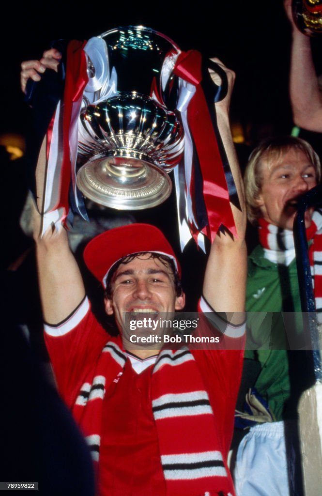 Sport. Football. pic: 26th May 1983. 1983 FA. Cup Final replay at Wembley. Manchester United 4 v Brighton and Hove Albion 0. Manchester United captain Bryan Robson lifts the FA. Cup.