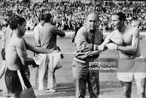 23rd July 1966, 1966 World Cup Finals, World Cup Semi-Final, England 1 v Argentina 0, Wembley, England Manager Alf Ramsey, does his best to stop...