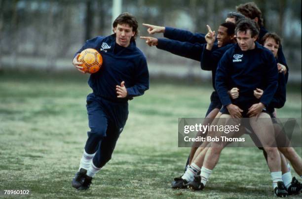 20th May 1985, England Training in Helsinki, Bryan Robson with the ball, with players Peter Reid, John Barnes and Trevor Steven in the queue