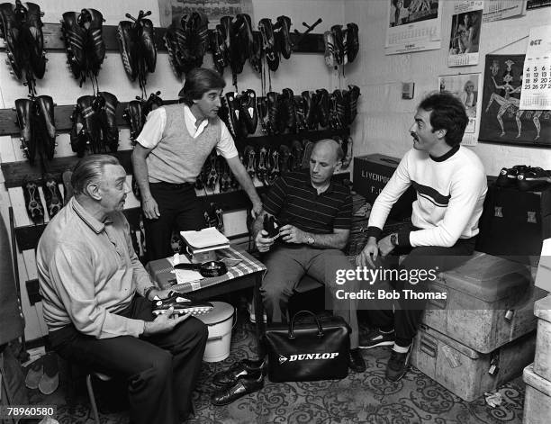 Football, 15th October 1982, Anfield, Liverpool, Liverpool goalkeeper Bruce Grobbelaar chats to backroom coaching staff of Joe Fagan, Roy Evans and...