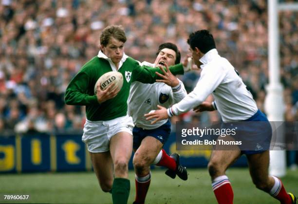 Sport, Rugby Union, pic: 21st March 1987, 5 Nations Championship in Dublin, Ireland 13 v France 19, Ireland wing Trevor Ringland hands off French...