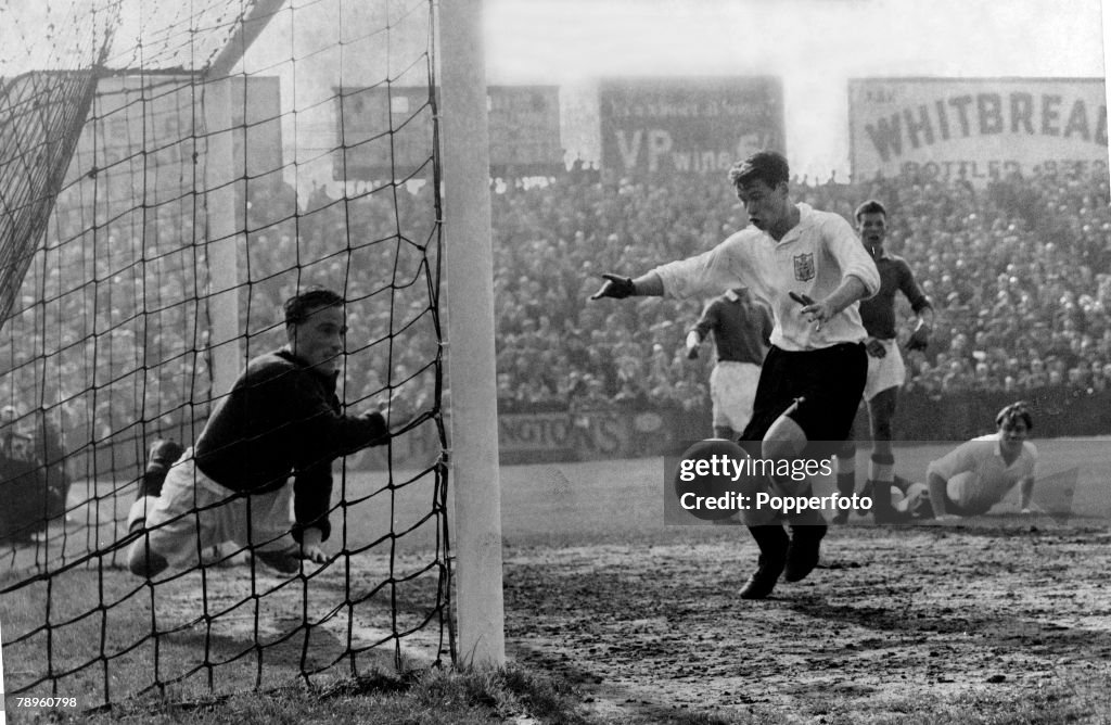 Sport. Football. pic: April 1953. Fulham v Swansea. Fulham's Bobby Robson about to score past Swansea goalkeeper Groves, although this "goal" was disallowed. However Robson was to score two more goals in the game.