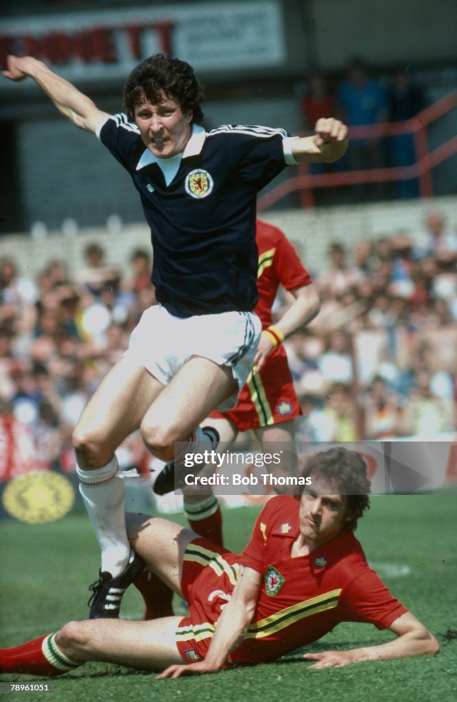 Sport. Football. pic: circa 1977. International Match. Wales v Scotland. Scotland's Derek Parlane hurdles an opponent. Derek Parlane won 12 Scotland international caps between 1973-1977.