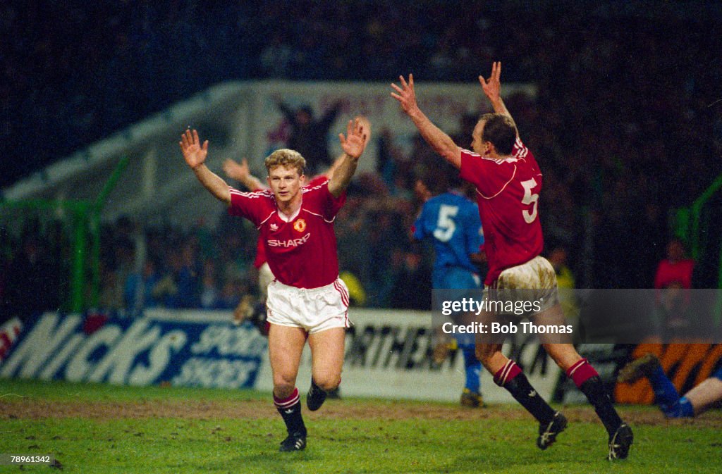 Sport. Football. pic: 11th April 1990. FA. Cup Semi-Final at Maine Road. Manchester United 2 v Oldham Athletic 1 a.e.t. Manchester United striker Mark Robins celebrates his match-winning goal with no5 Mike Phelan.