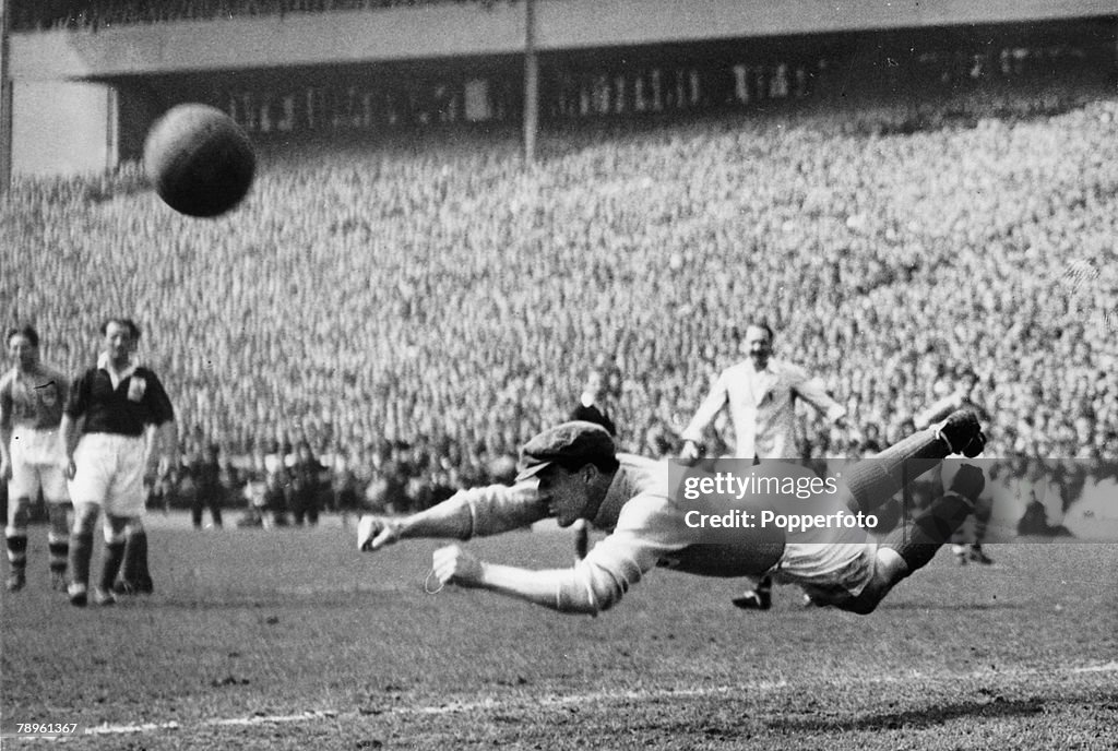 Sport. Football. pic: 10th May 1947. Representative Match at Hampden Park, Glasgow. Great Britain 6 v Rest of Europe 1. Great Britain's goalkeeper Frank Swift dives through the air as he attempts to stop the ball.