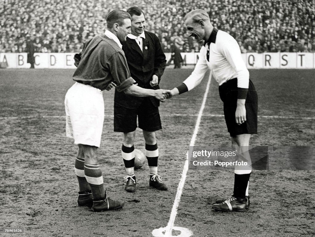 Football. 4th, December. 1935. White Hart Lane, London. England 3 v Germany 0. England Captain, Eddie Hapgood and German skipper, Szepan, shake hands in the centre circle prior to the International match.