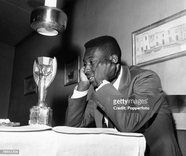 Sport, Football, circa 1958, Brazil's young star Pele with his eyes on the ultimate prize the Jules Rimet World Cup trophy, Pele was perhaps the most...