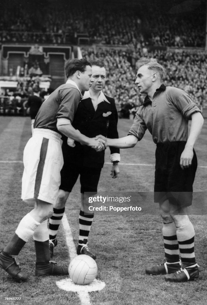 Sport. Football. pic:30th April 1949. 1949 FA. Cup Final at Wembley. Wolverhampton Wanderers 3 v Leicester City 1. Rival captains Billy Wright, right, Wolverhampton Wanderers and Norman Plummer, Leicester City shake hands before the game.