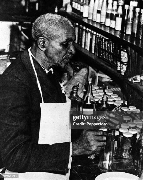 Picture of George Washington Carver , the US botanist, Agricultural chemist and scientist, seen here in his laboratory at Tuskegee