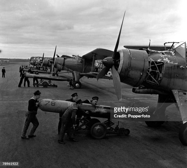 World War II, England Fleet Air Arm Torpedo Training School, Torpedos are pictured being loaded onto Albacore aircraft