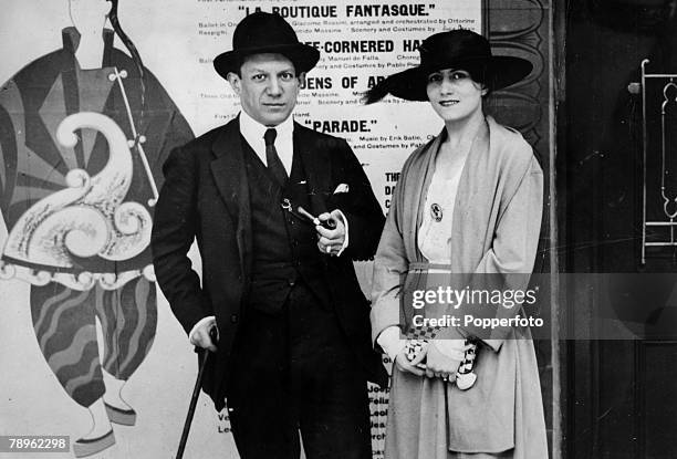 Spanish painter, sculptor and artist Pablo Picasso posed with Russian ballet dancer Olga Khokhlova at the opening of the ballet 'Parade' featuring...