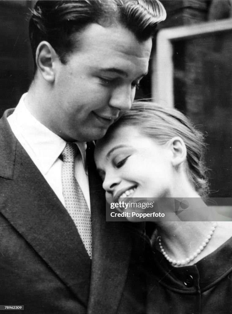Stage and Screen. Personalities. pic: July 1956. English theatre, opera and film director Peter Hall pictured with French actress Leslie Caron at the time they announced their engagement. Peter Hall was knighted in 1977.