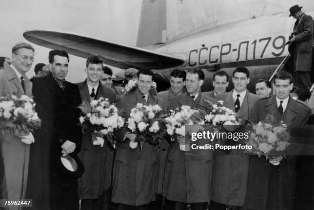 8th October 1954, Moscow, Arsenal F,C, presented with bouquets after their arrival at Vnukpvo Airport, Left-right, Bob Wall, , Russian Official,...