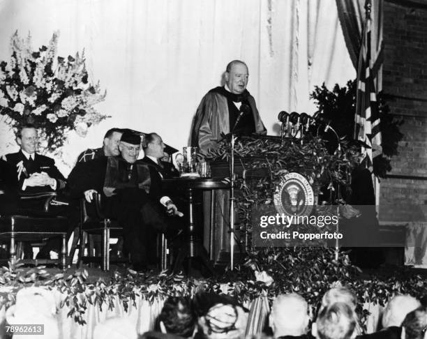 British statesman Winston Churchill giving a speech at Westminster College, Fulton, Missouri, USA, 5th March 1946. Behind him is US President, Harry...