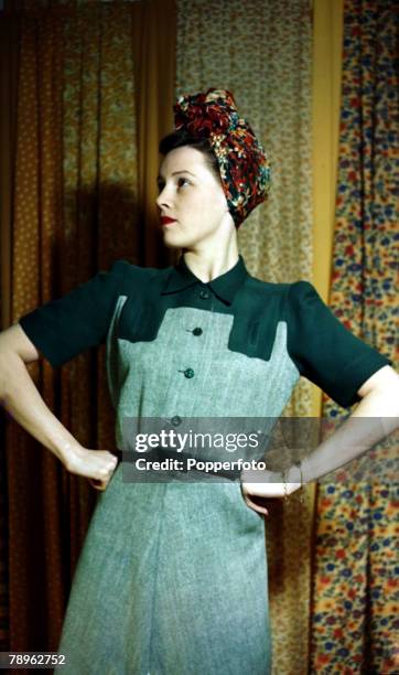 World War II, Fashion, pic: February 1943, Model wearing a dress Green Park is the colour and herringbone allies with plain yoke, The dress costs 60...