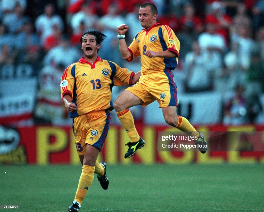 Football. European Championships (EURO 2000). Stade du Pays de Charleroi, Belgium. England 2 v Romania 3. 20th June, 2000. Romania+s Dorinel Munteanu jumps for joy after scoring the goal to equalise at 2-2. Joining him in his celebrations is Cristian Chiv